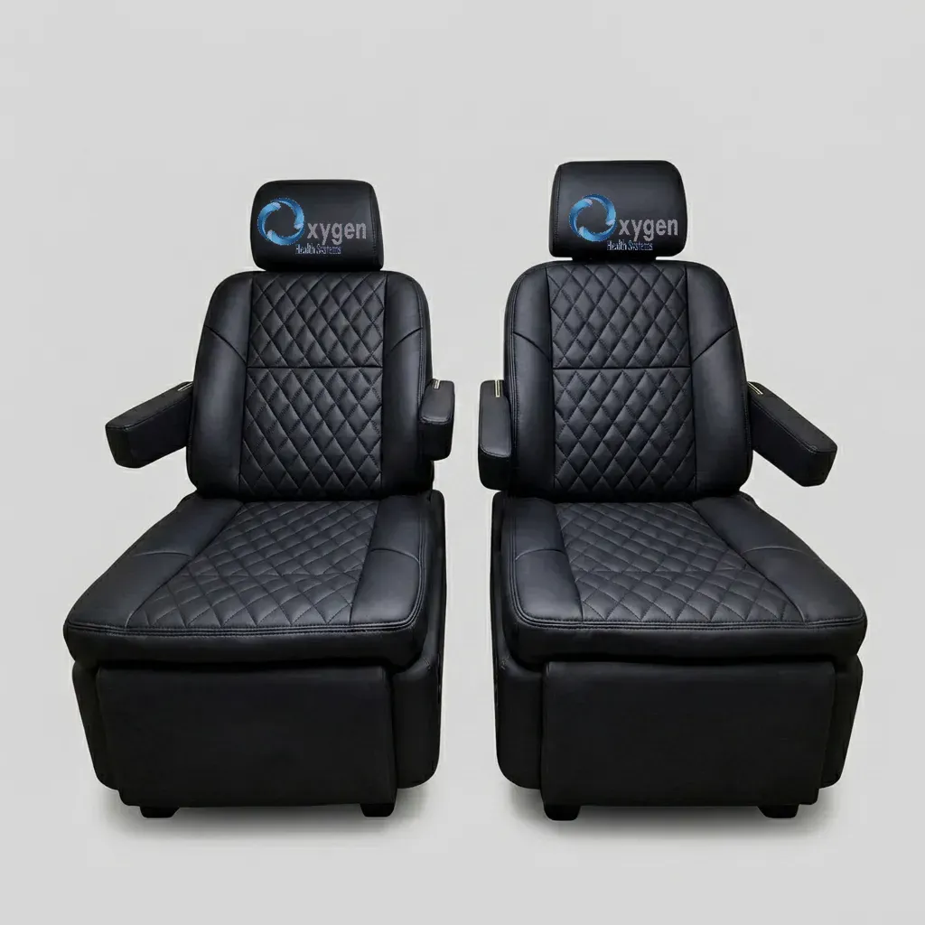 Premium black quilted leather captain's chairs reclined with footrests extended, showing electric reclining and footrest adjustment